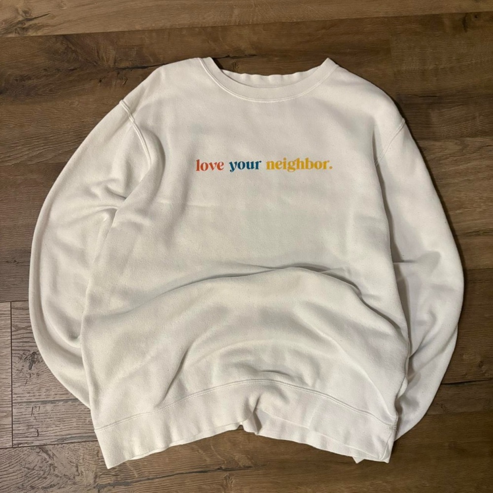 White Sweatshirt with “love your neighbor”